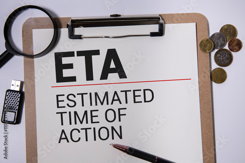 Flash card with handwriting in word ETA abbreviation of estimated time of arrival on wood background