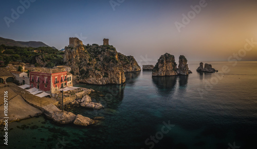 Wonderful Sights of The Stacks and Tonnara of Scopello Faraglioni e Vecchia Tonnara di Scopello , in Trapani Province, Sicily, Italy. June 2023, sunrise photo