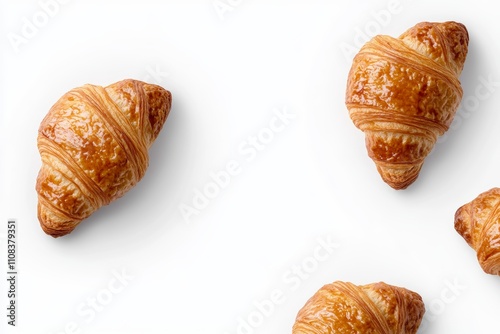 Four golden croissants on white background photo