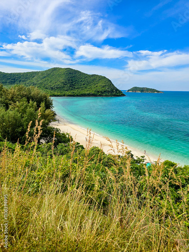 Tranquil shores and vibrant waters of Samae San Island in Thailand on a sunny day photo