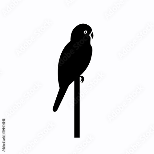 Colorful parrot perched on a slender branch against a plain background in daylight