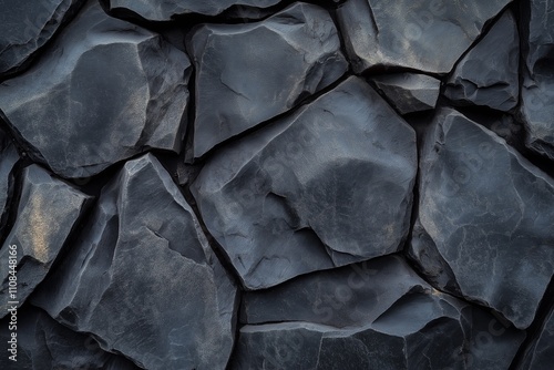 High-resolution photography of bold black rock textures with refined details.