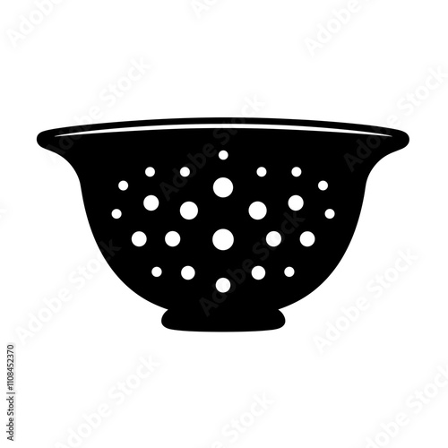 Colander with holes used for draining pasta in a kitchen setting