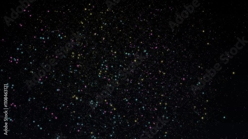 A vibrant display of colorful sparkling stars and particles against a deep black background, resembling a mesmerizing fireworks or galaxy scene.