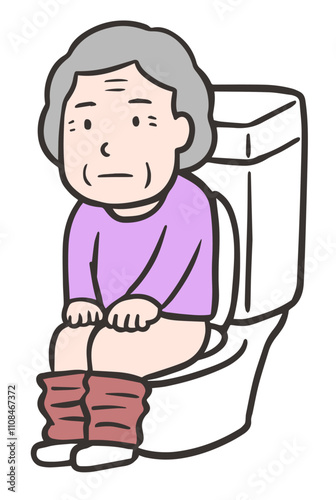 トイレに座って排泄をする高齢者の女性