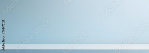 Neutral pale blue background with smooth texture, ideal for placing a product with plenty of space around it for emphasis.