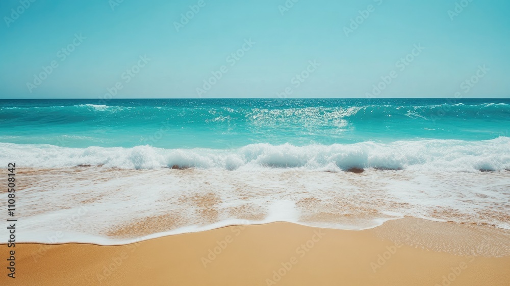 Fototapeta premium Tranquil Ocean View with Gentle Waves Approaching Sandy Shore Under Clear Blue Sky for Peaceful Relaxation and Meditative Environment