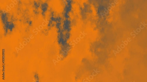 Orange sky with dark gray clouds is ideal for dramatic and moody design projects, naturethemed content, or atmospheric visual storytelling.
