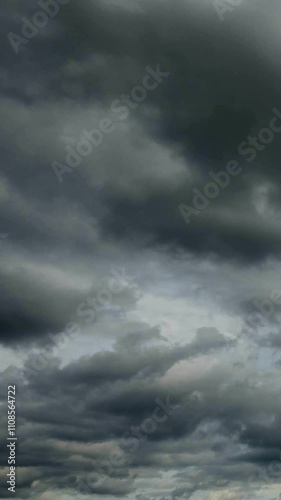Time lapse of flying grey clouds over horizon, no flicker, no birds.