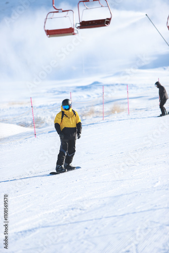 Mongolian snow skiing Resort in Ulaanbaatar. Young boys skating on hoverboard.