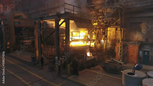 Raging flames in a metal production furnace.