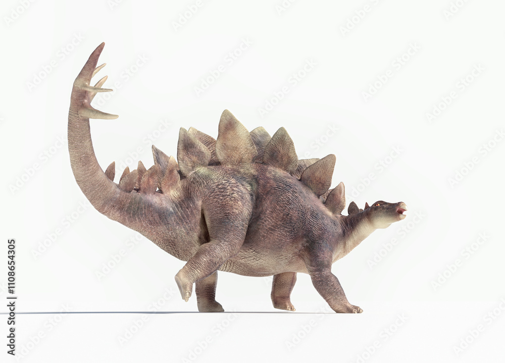 Fototapeta premium Stegosaurus walking on a white background, showcasing its distinctive spine plates and strong limbs
