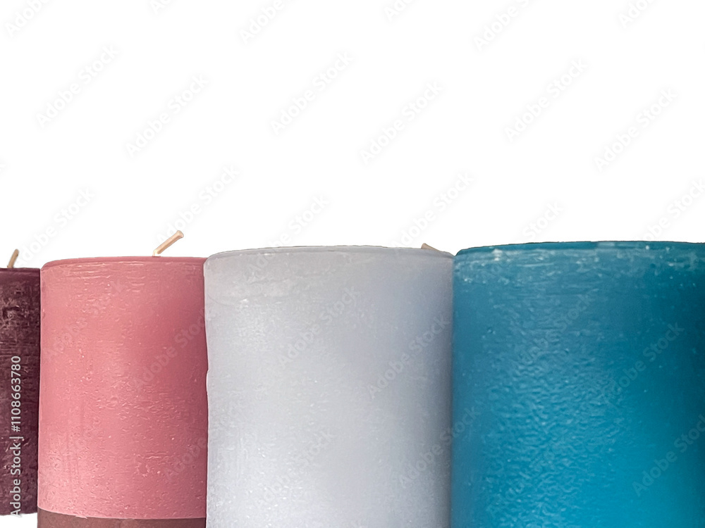 round candle assortment, blue, white, red on a white background, close up, copy space round candle assortment, blue, white, red on a white background, close up, copy space