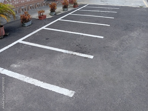 Empty motorcycle parking lot with white line on the road.  photo taken in malaysia
 photo