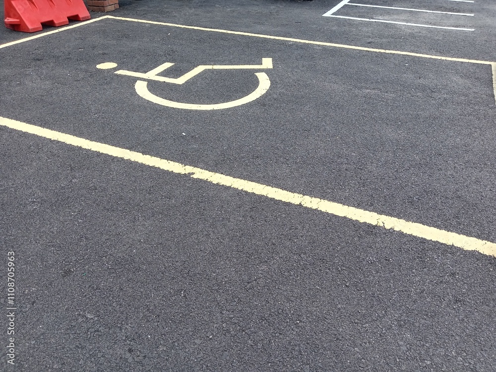 Obraz premium Disabled parking sign on the road, concept of handicapped parking. photo taken in malaysia 
