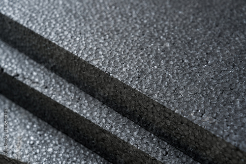 Top view of grey thermal insulation styrofoam sheets stacked on top of each other