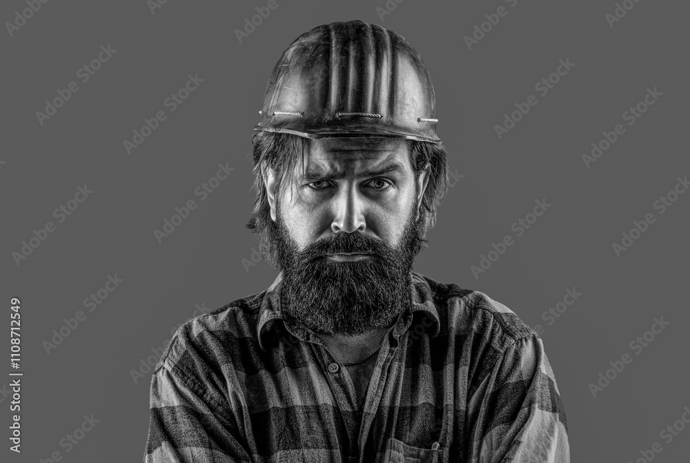 Fototapeta premium Building, industry. Builder in hard hat, foreman or repairman in the helmet. Black and white