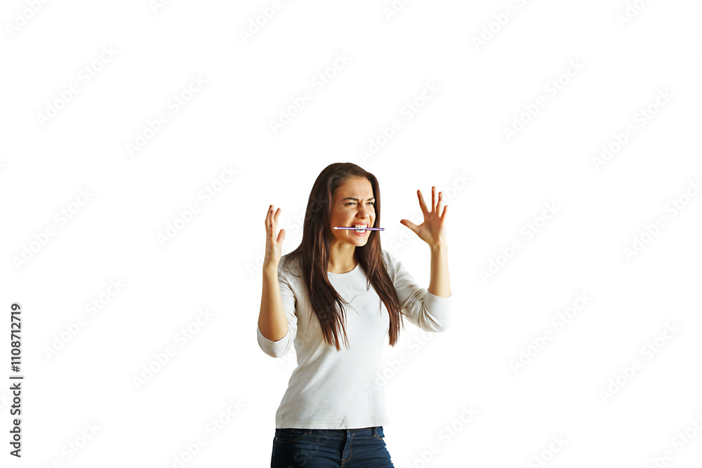 Woman showing frustration with hands raised, pen in mouth, wearing casual clothes, isolated on white background, concept of stress Woman showing frustration with hands raised, pen in mouth, wearing casual clothes, isolated on white background, concept of stress