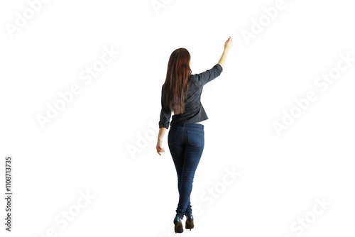 Woman standing with her back turned, wearing casual clothing, gesturing upwards. Isolated on a white background. Concept of direction or teaching