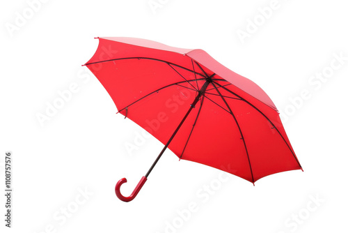 Bright red umbrella resting elegantly against a plain white background showcasing its vibrant color and classic design