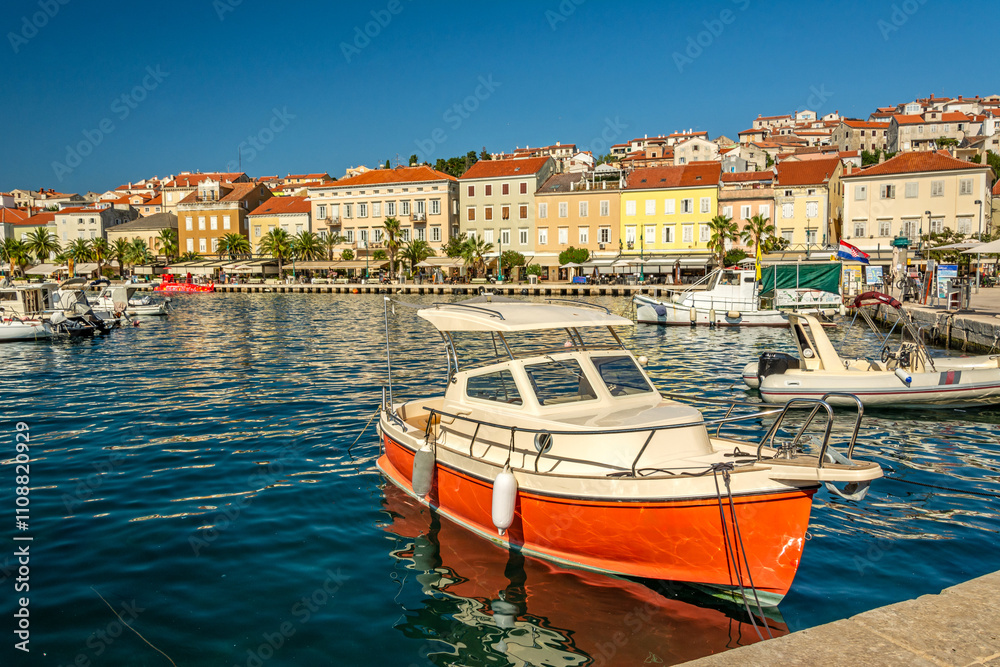 Obraz premium Small boat in the marina of Mali on the island of Losinj in the Adriatic Sea, Croatia