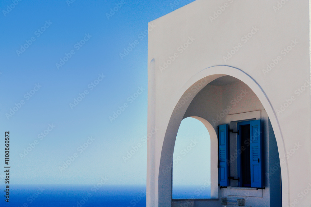 Fototapeta premium Santorini house opening its windows to the ocean.