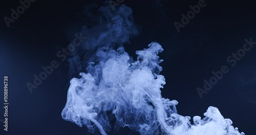 Abstract image of dark room concrete floor. Black room or stage background for product placement.Panoramic view of the abstract fog. White cloudiness, mist or smog moves on black background. 