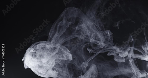 Abstract image of dark room concrete floor. Black room or stage background for product placement.Panoramic view of the abstract fog. White cloudiness, mist or smog moves on black background. 