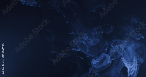 Abstract image of dark room concrete floor. Black room or stage background for product placement.Panoramic view of the abstract fog. White cloudiness, mist or smog moves on black background. 