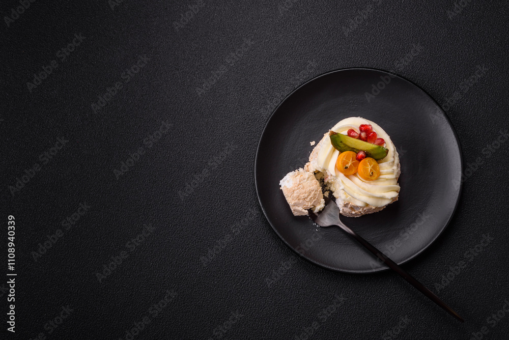 Piece of sweet meringue with citrus, kiwi and pomegranate seeds Piece of sweet meringue with citrus, kiwi and pomegranate seeds