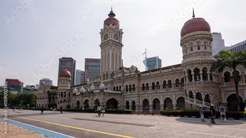 Kuala Lumpur, Malaysia, August 31, 2024: Time Lapse of Clock Tower of Sultan Abdul Samad Building at Merdeka Square. The popular places for tourism.