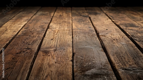 an old wooden table with a dark background The table is made of wood and has a rustic, aged look to it The wood has a weathered, aged appearance, with visible sig