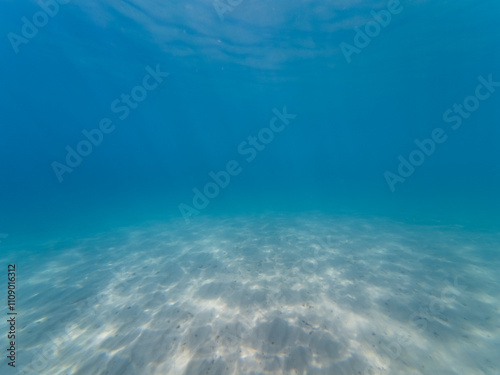 Underwater photo, sandy bottom and azure sea off the southern coast of France. photo