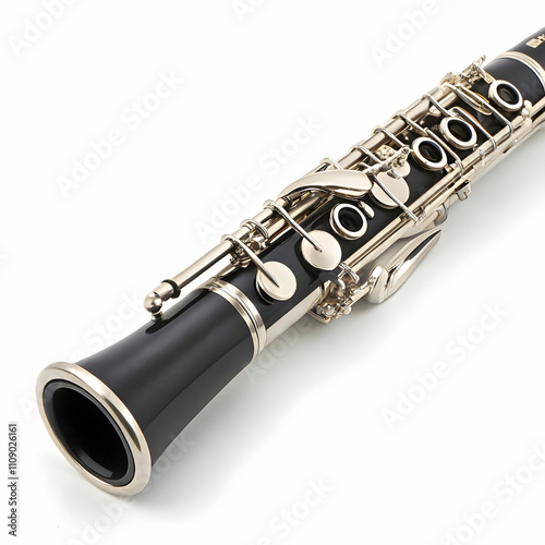 A silver clarinet with a black mouthpiece and intricate keywork photo