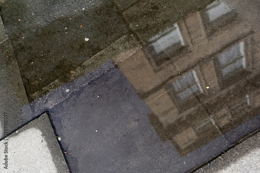 Fototapeta premium Residential victorian buildings reflected in a pool of water - Hillside street - Edinburgh - Lothian - Scotland - UK