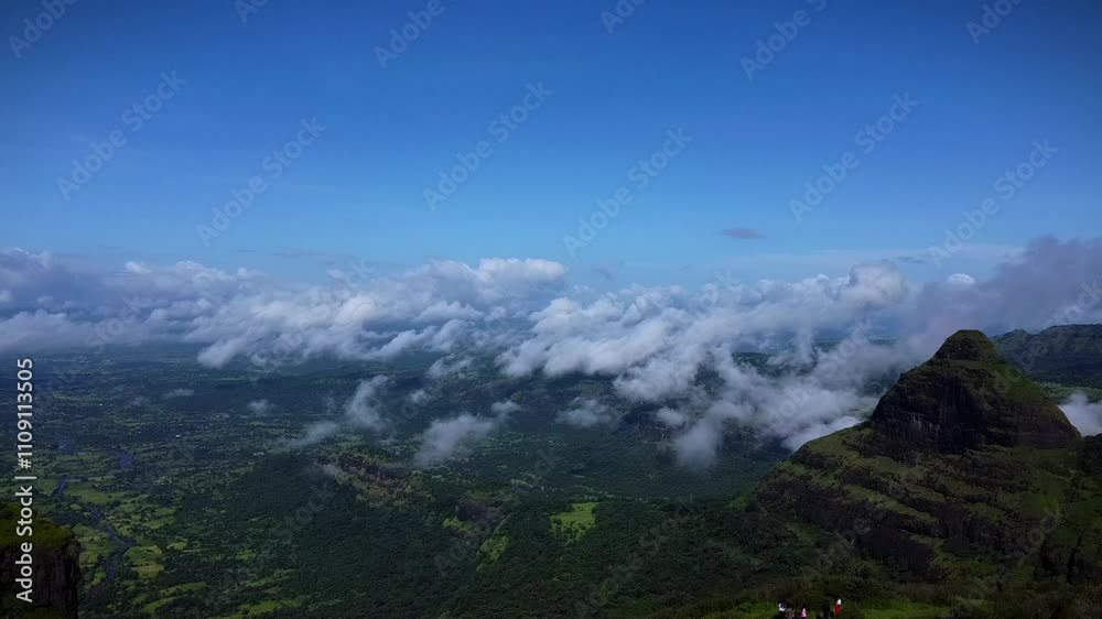 Aerial view of Tiger Point Lonavala with green landscape under clouds and blue sky Aerial view of Tiger Point Lonavala with green landscape under clouds and blue sky