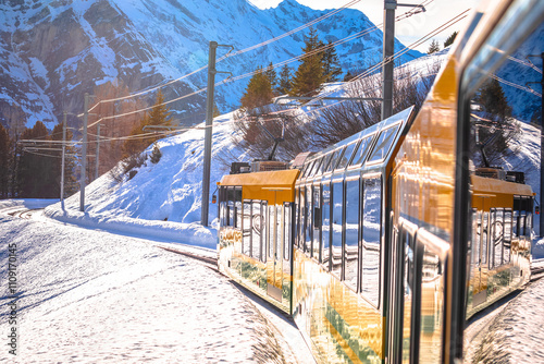 Obraz na płótnie Wengen railway to Jungfraujoch peak train in winter landscape view, Berner Oberland w salonie