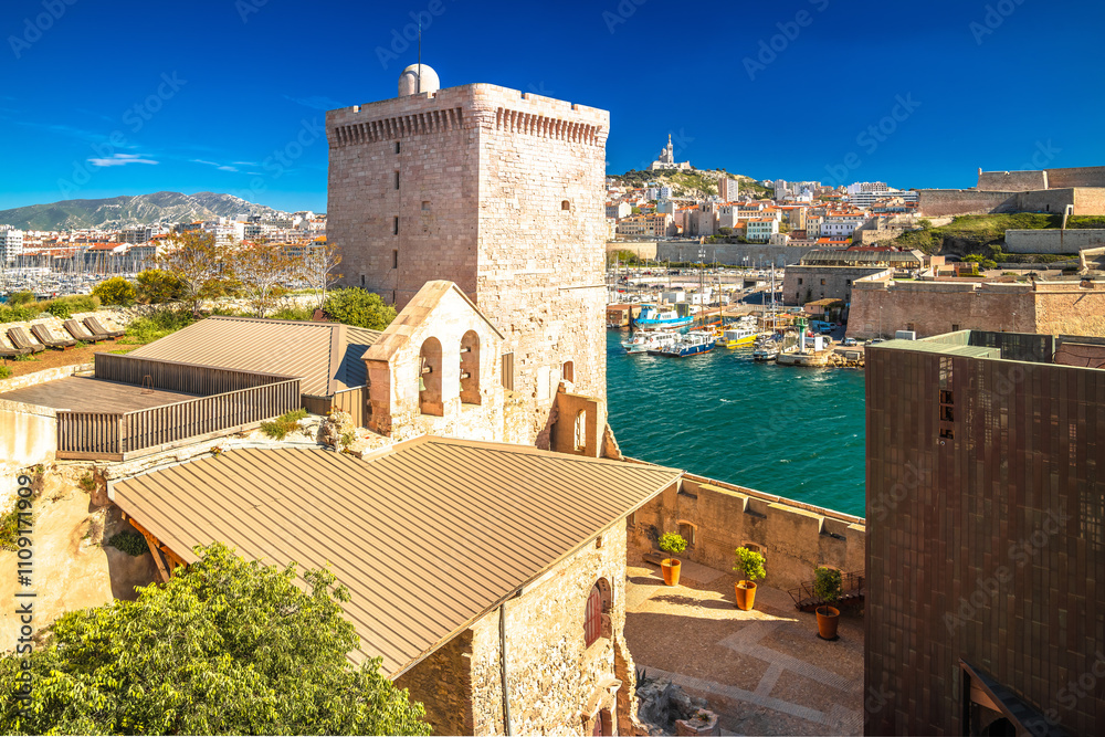 City of Marseille harbor historic architecture and Notre Dame de la Garde church on the hill view