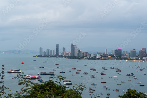 A city with a large body of water in the background