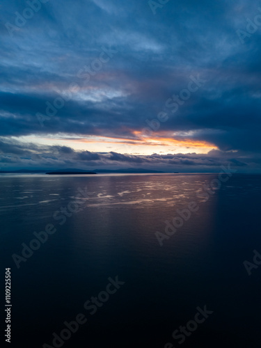 Dramatic Sunrise Over Vancouver Island's Serene Coastal Waters