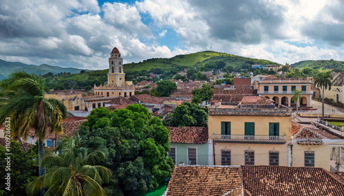 Obraz na płótnie Picturesque view of Trinidad, Cuba, showcasing colonial architecture, lush greenery, and historic charm under a vibrant blue sky with scattered clouds w salonie