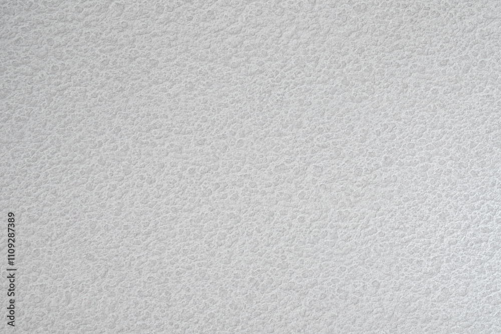 A white wall with a textured surface. The wall is covered in a pattern of small bumps white gray texture background for template, page or web banner A white wall with a textured surface. The wall is covered in a pattern of small bumps white gray texture background for template, page or web banner