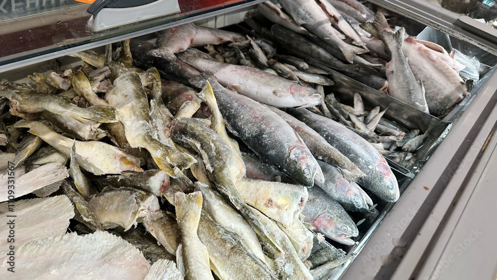 Frozen or fresh fish on the counter in the supermarket Frozen or fresh fish on the counter in the supermarket