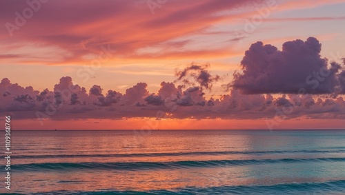 A picturesque sunset with waves gently caressing the horizon.