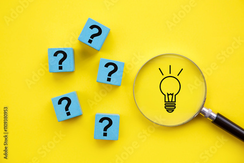 Light bulb in magnifying glass and question mark sign; Concept of solving problem and creative thinking