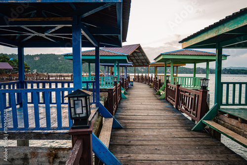 Baubau, Indonesia, March 24 2024 - Titian Bridge, Wooden Pier at Batusori Tourist Attraction When Tranquility Meets Nature photo