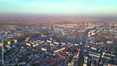 Wallpaper Mural Aerial drone footage of a sunset over the city of Plovdiv in Bulgaria. Ancient city of Filipopolis filmed from above on a warm autumn afternoon. European city seen from a helicopter establishing shot. Torontodigital.ca