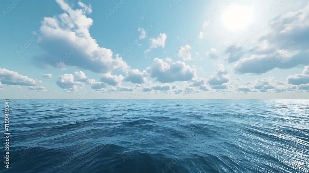 Fototapeta premium A serene ocean view under a bright sky with fluffy clouds reflecting tranquility.