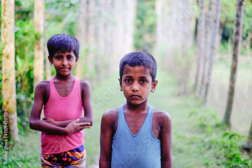 Portrait of south asian young rural boys in outdoor wearing undershirt 