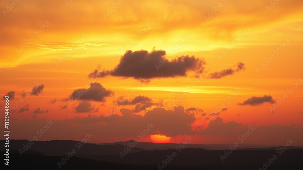 A vibrant sunset with fiery orange hues painting the sky, casting long shadows on the distant hills, creating a dramatic and breathtaking vista. A vibrant sunset with fiery orange hues painting the sky, casting long shadows on the distant hills, creating a dramatic and breathtaking vista.